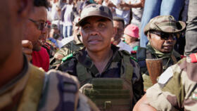 CAPSAT military unit commander Col. Michael Randrianirina joins protesters to announce that the armed forces are taking control of the country in Antananarivo, Madagascar, Tuesday, Oct. 14, 2025.