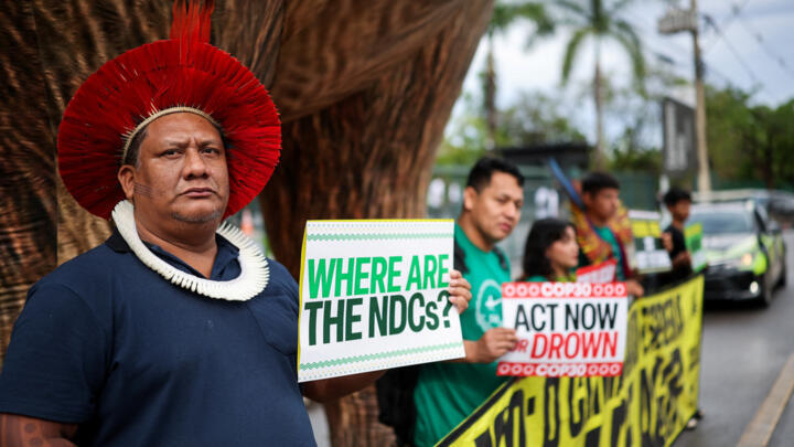 Activists from the Brazilian Amazon stand next to an inflatable capybara during a protest calling on COP30 negotiators to protect Amazonian forests, October 2025.