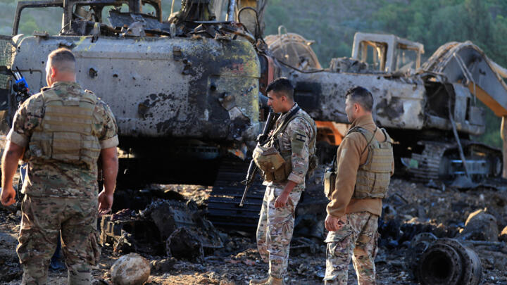 Lebanese army soldiers look at the destruction following Israeli airstrikes, in the southern village of Msayleh, Lebanon, on October 11, 2025. 