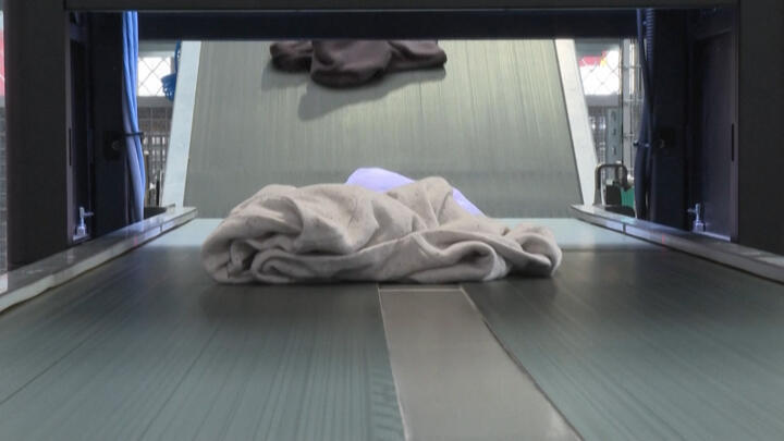 Clothes on a sorting machine in Hendaye, France.