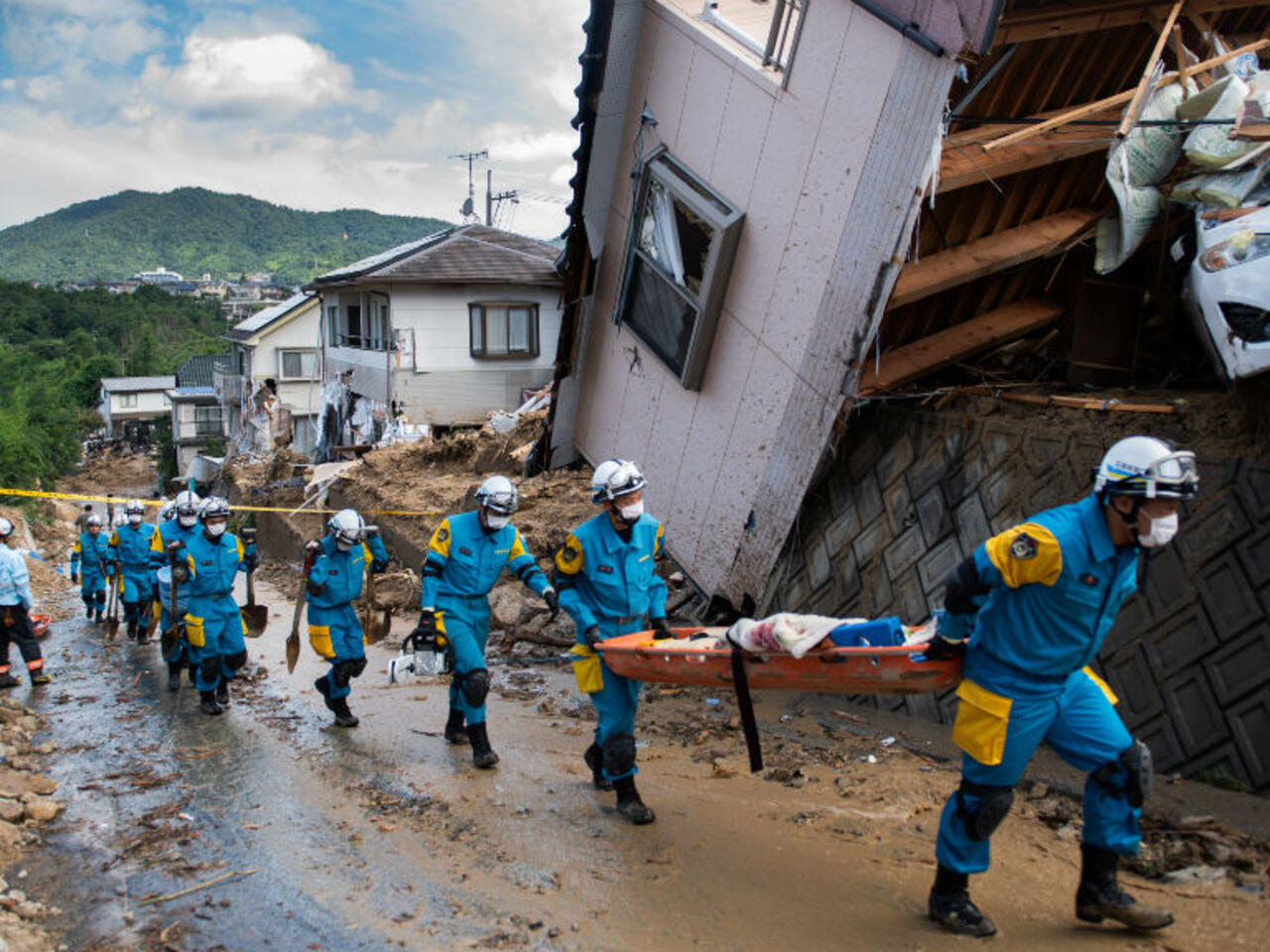 Japan races to find survivors as floods kill at least 100