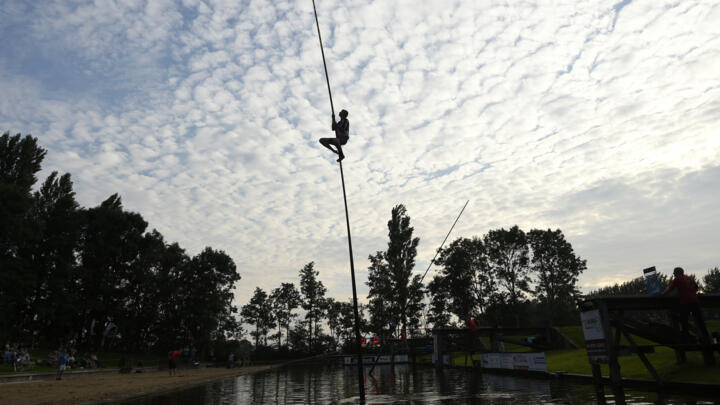 The sport involves competitors sprinting towards the water and launching themselves into the air on a 12-metre carbon pole