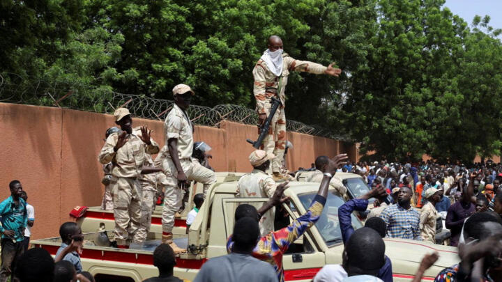 Niger security forces prepare to disperse demonstrators gathered outside the French embassy in Niamey on July 30, 2023.