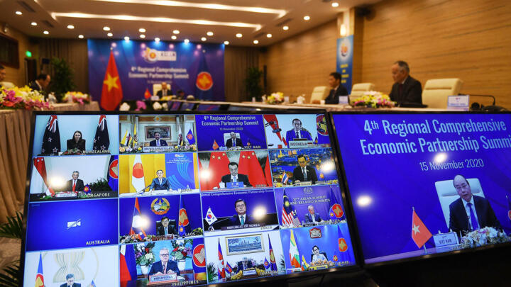 Vietnam's Prime Minister Nguyen Xuan Phuc (R) as he addresses his counterparts during the 4th Regional Comprehensive Economic Partnership (RCEP) Summit being held online in Hanoi on November 15, 2020.