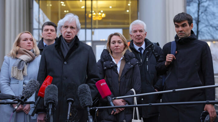 Lawyer Genri Reznik speaks to the media next to members and lawyers of the Moscow Helsinki Group, one of Russia's oldest human rights organizations, after a hearing on the lawsuit to liquidate the Moscow Helsinki Group, in Moscow, January 25, 2023.
