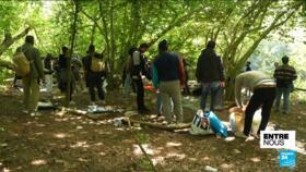 A group of migrants whose makeshift camp near Calais had just been found and dismantled by the French police.
