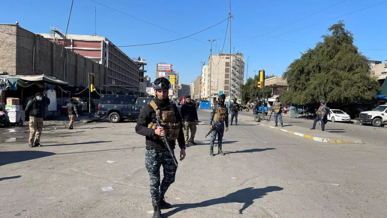 Iraqi security forces secure the site of a suicide attack in Baghdad, Iraq January 21, 2021.