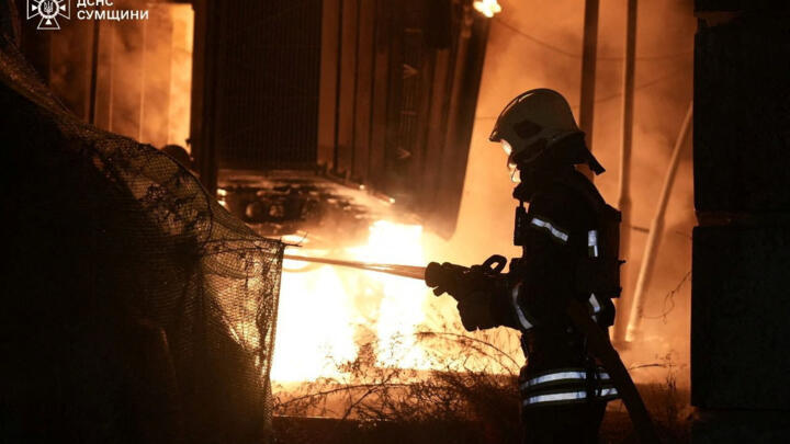 A firefighter works at the site of the Russian drone strike in Sumy region, Ukraine in this handout picture released August 27, 2025.