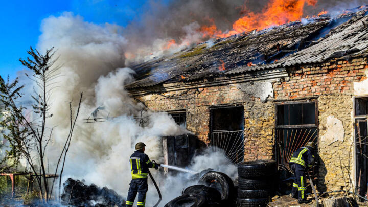 Firefighters put out a fire at a warehouse after shelling in Kherson, Ukraine on September 19, 2023.