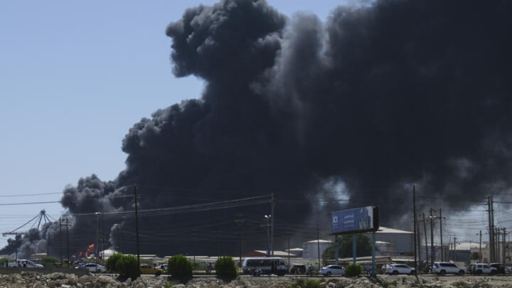 Smoke billows after drone strikes by the paramilitary Rapid Support Forces (RSF) in the Red Sea city of Port Sudan in this file photo from May 2025.