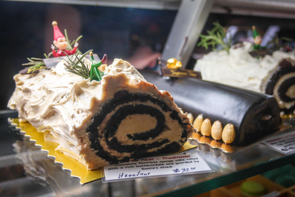 A traditional French bûche de Noël on display at a bakery.