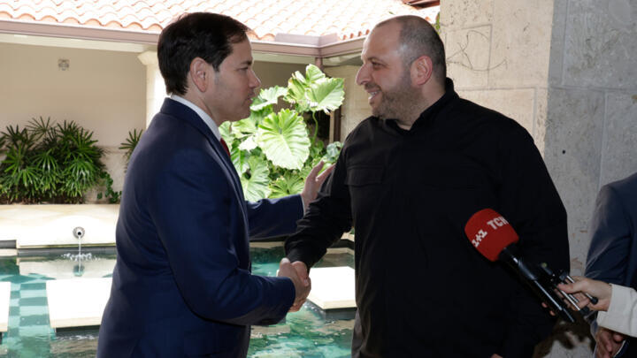 US Secretary of State Marco Rubio and Ukraine's Secretary of National Security Rustem Umerov shake hands, on November 30, 2025, in Florida.