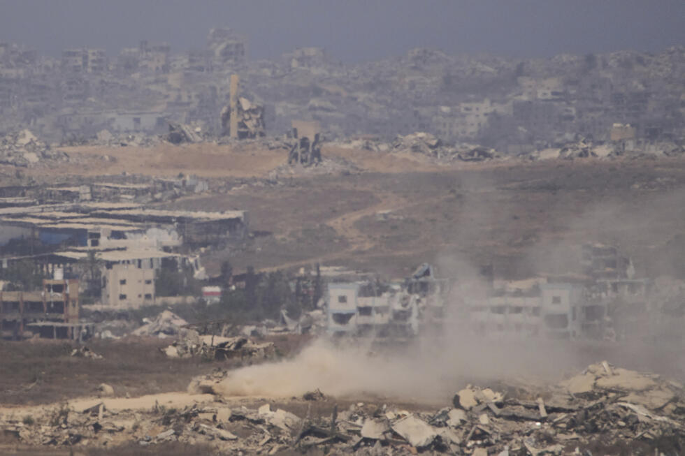 Israeli soldiers drive on their armored personnel carrier inside the northern Gaza Strip, as seen from southern Israel, Tuesday, July 29, 2025.