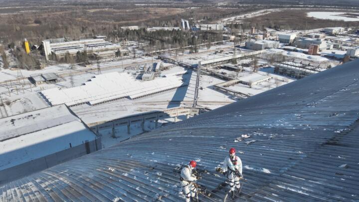 This handout photograph taken by Ukrainian Emergency Service on February 17, 2025, shows the damaged containment vessel at the New Safe Confinement (NSC) following a drone attack on  in Chernobyl.