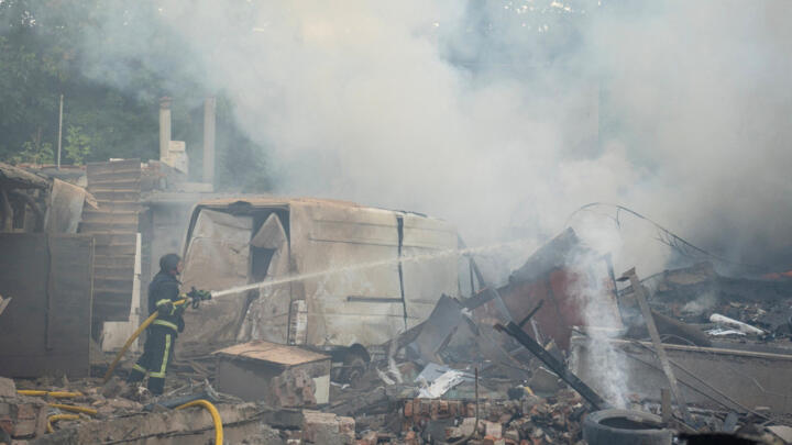 A firefighter works at the site of a Russian strike in Khmelnytskyi, in western Ukraine on September 3, 2025.
