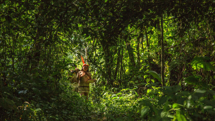 Waorani indigenous women walk in Gareno, 175 km southeast of Quito, Ecuador, in 2015.
