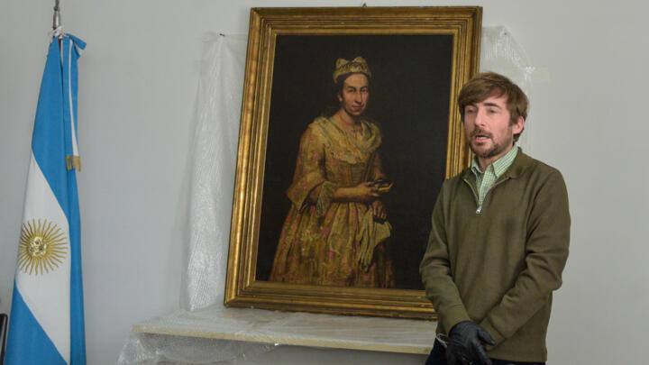 Art expert Ariel Bassano with the Nazi-looted 'Portrait of a Lady' after it was retrieved by Argentine authorities from the daughter of an SS officer in the resort of Mar del Plata.