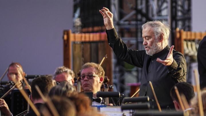 Russian conductor Valery Gergiev leads the orchestra during a concert on Moscow's Red Square on May 24, 2024.