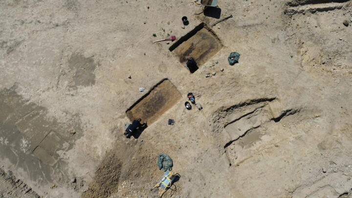 An aerial photo shows archaeologists working at a Viking Age burial site in Lisbjerg, a village seven kilometres north of Aarhus, Denmark's second-largest city, on June 13, 2025.