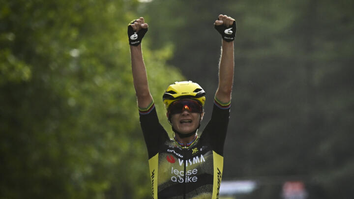 Dutch rider Marianne Vos celebrates as she crosses the finish line to win the 1st stage of the Women's Tour de France cycling race in Plumelec, western France, on July 26, 2025.