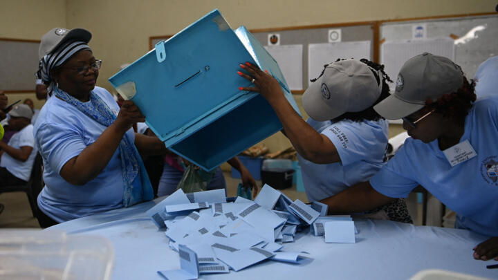 Electoral officials organise the ballot papers for verification at a counting centre in Gaborone-Bonington North constituency on October 31, 2024. 