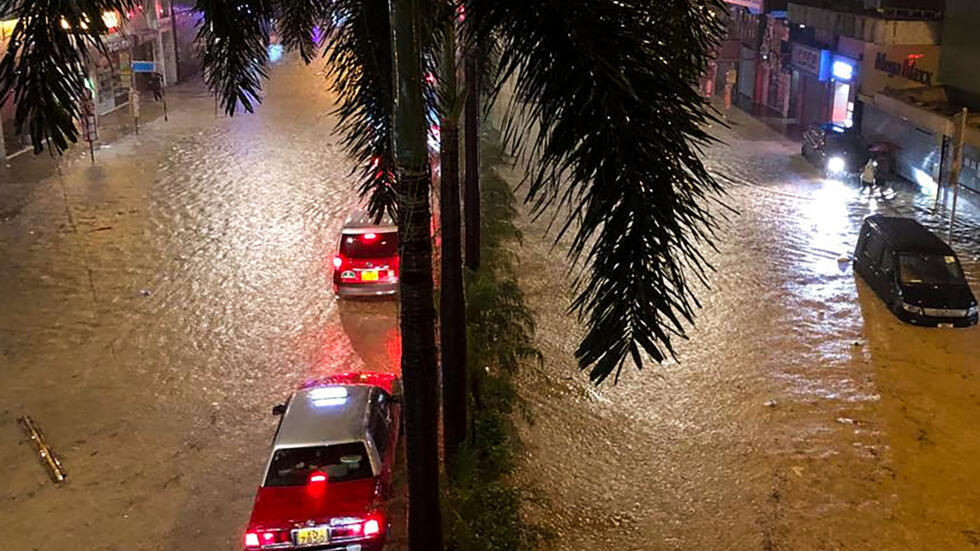 Record rainfall causes flooding in Hong Kong days after typhoon