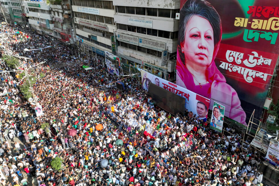 Bangladesh Nationalist Party (BNP) members rally infront of a poster of Khaleda Zia in August 2024