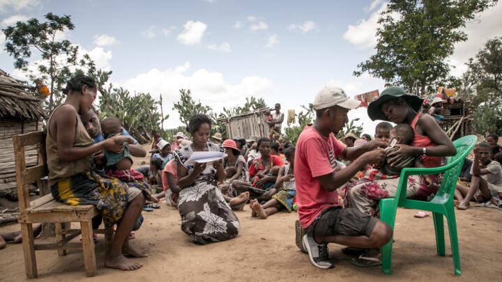 A member of the NGO Action Contre la Faim measures the arm circumference of infants to detect possible cases of malnutrition in the municipality of Ifotaka, in southern Madagascar.