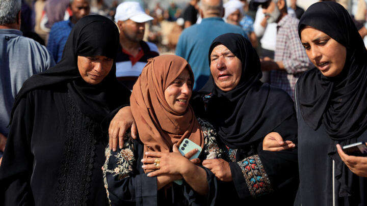Mourners attend the funeral of Palestinians killed in what Gaza health officials say was Israeli fire near a distribution site in Rafah on June 3, 2025.