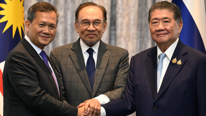 Malaysia's Prime Minister Anwar Ibrahim (centre), Cambodia's Prime Minister Hun Manet (left) and Thailand's acting Prime Minister Phumtham Wechayachai (right) in Putrajaya on July 28, 2025.