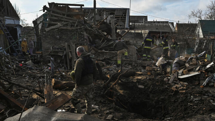 Rescuers work at the site of residential buildings damaged during a Russian drone strike, amid Russia's attack on Ukraine, in Zaporizhzhia, Ukraine March 28, 2024.