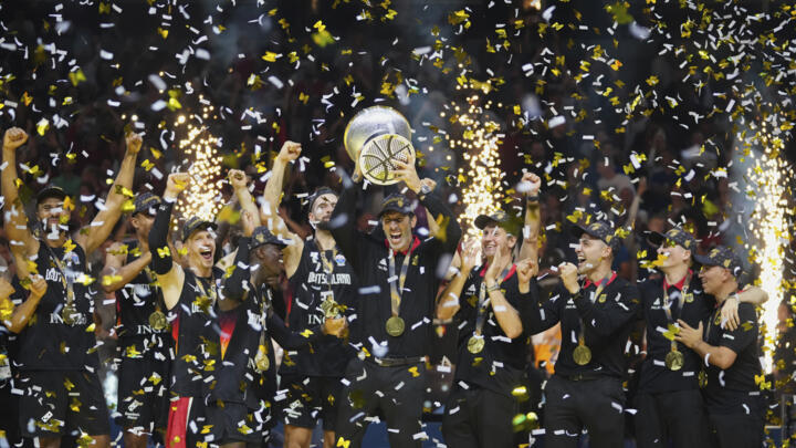 Germany's head coach Alex Mumbru rises the trophy and celebrates with players after winning the Eurobasket, European Basketball Championship final match between Turkey and Germany.