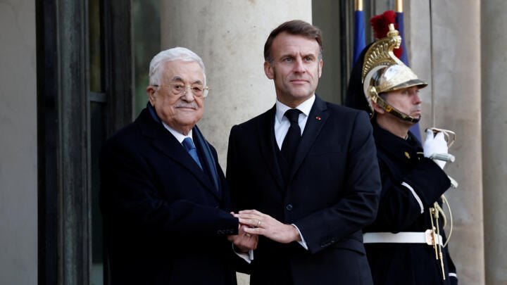 French President Emmanuel Macron welcomes President Mahmoud Abbas at the presidential Élysée Palace on November 11, 2025.