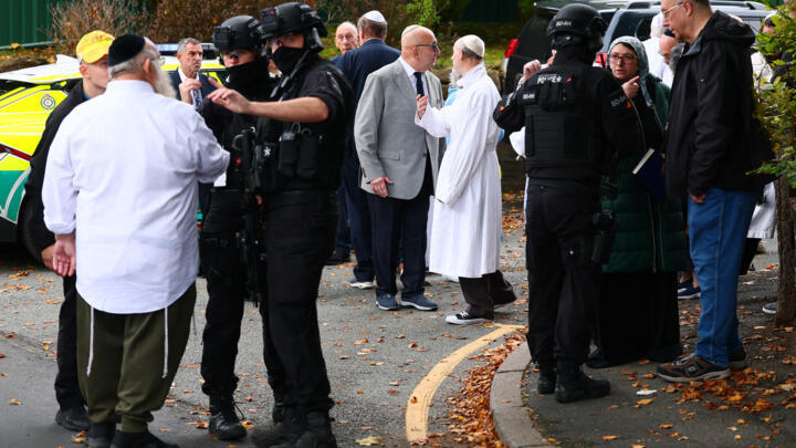 Armed police officers near the Heaton Park Hebrew Congregation synagogue in Crumpsall, northern Manchester, on October 2, 2025.