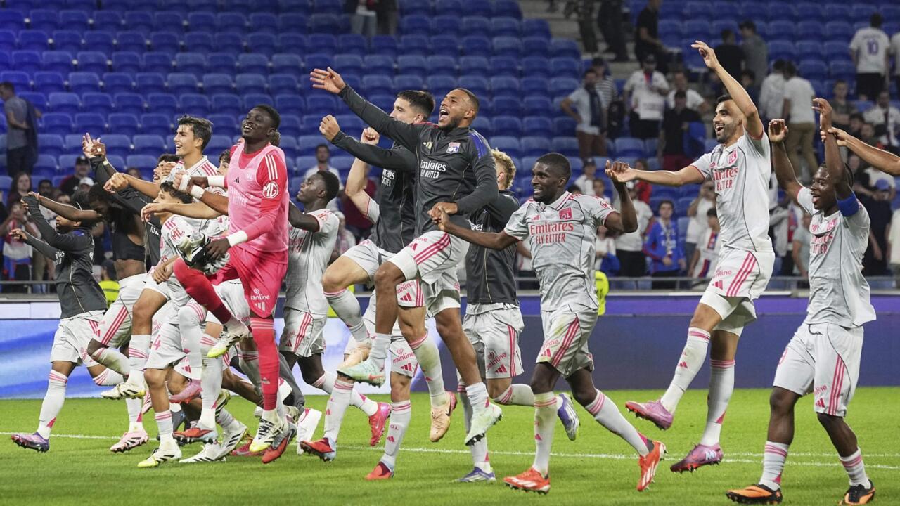 Lyon players celebrate their victory at Groupama stadium in Decines, outside Lyon, France, as they're top of Europa League.