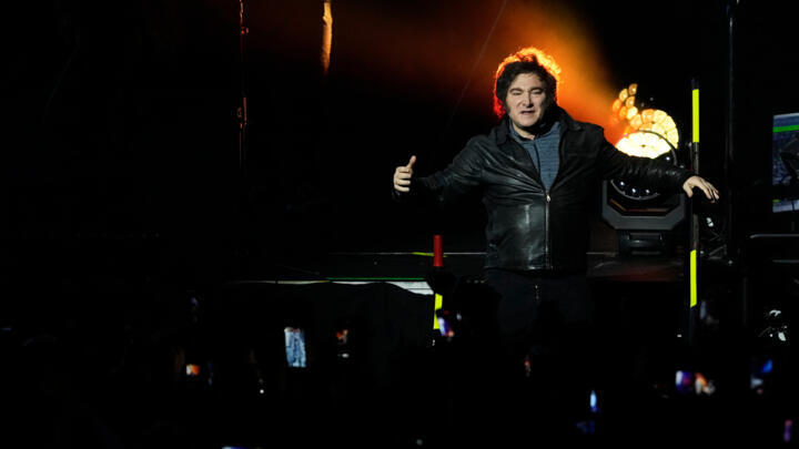 Argentine President Javier Milei perfroms with his band during the presentation of his book "The Construction of the Miracle" in Buenos Aires,  October 6, 2025.