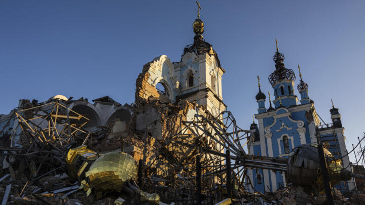 A cupola lies on the ground in front of the Orthodox Church which was destroyed by Russian forces in the recently retaken village of Bogorodychne, Ukraine, on January 7, 2022. 