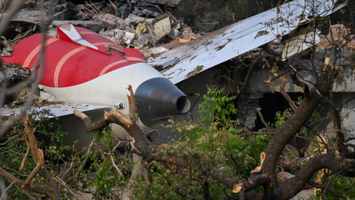 Wreckage showing the tail section of the Air India Boeing 787-8 is pictured in a residential area near the airport in Ahmedabad on June 14, 2025.