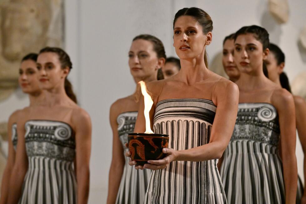 Organisers were forced to head indoors for the Olympic flame ceremony due to a rainy weather forecast