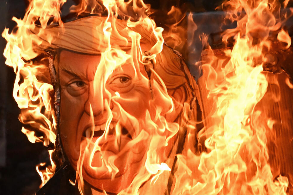 Activists burn an effigy of US President Donald Trump during a protest to express solidarity with Palestinians in Kolkata on October 7, 2025, the second anniversary of the attack.