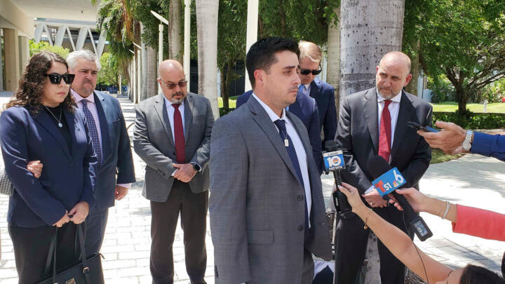Dillon Angulo, who was seriously injured in a Florida crash involving Tesla's Autopilot driver assist technology, speaks to reporters outside the federal courthouse in Miami, August 1, 2025.