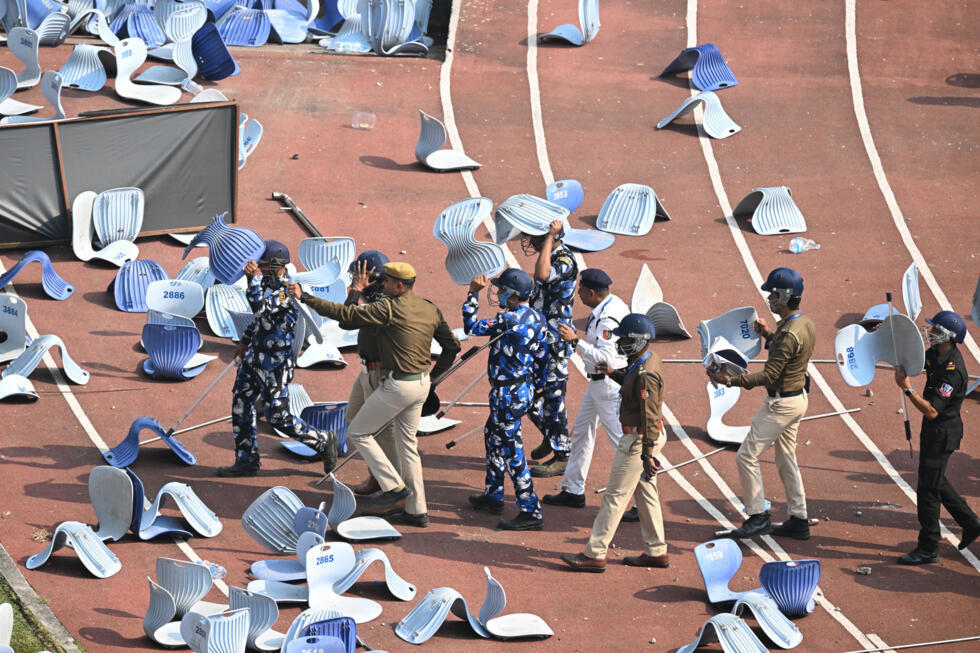 Disappointed fans pelted security officials with chairs ripped from the stadium