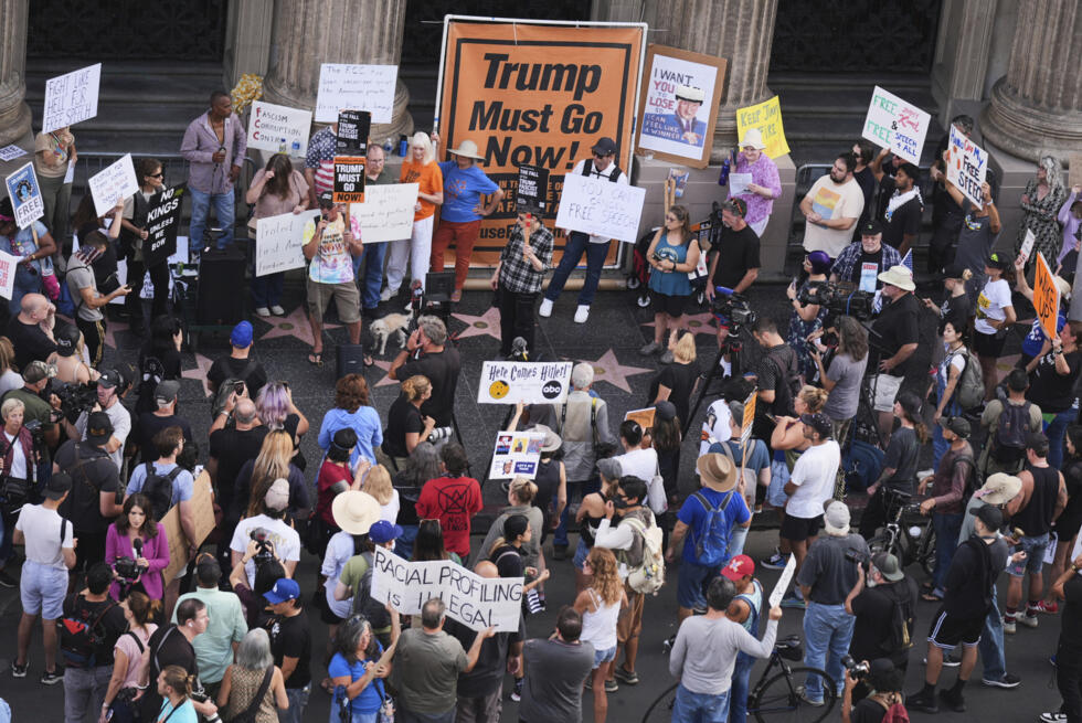 Demonstrators hold signs outside the Hollywood studio where the Jimmy Kimmel show is staged on September 18, 2025.