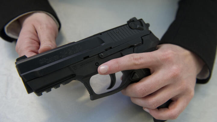 French gendarmes (national police) are equipped with the SIG Sauer SP 2022 9mm pistol, pictured here at the German-Swiss company’s stand at the European Police Congress in Berlin, Germany on February 15, 2011.