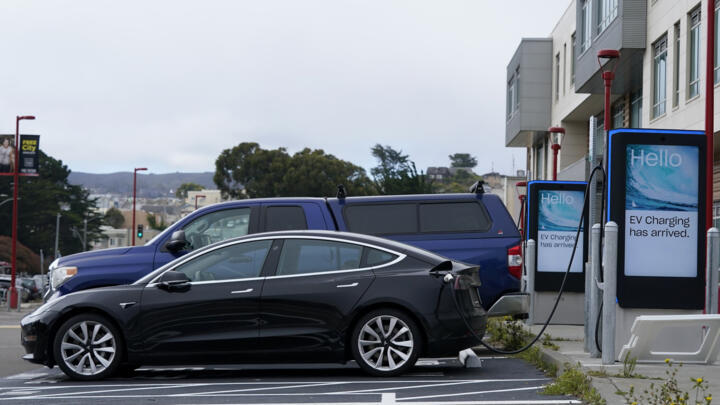 Cars are parked at an electric charging station in San Francisco, Thursday, Aug. 25, 2022.