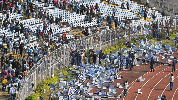 Fans threw chairs onto the track of a stadium in Kolkata following an appearance of football star Lionel Messi