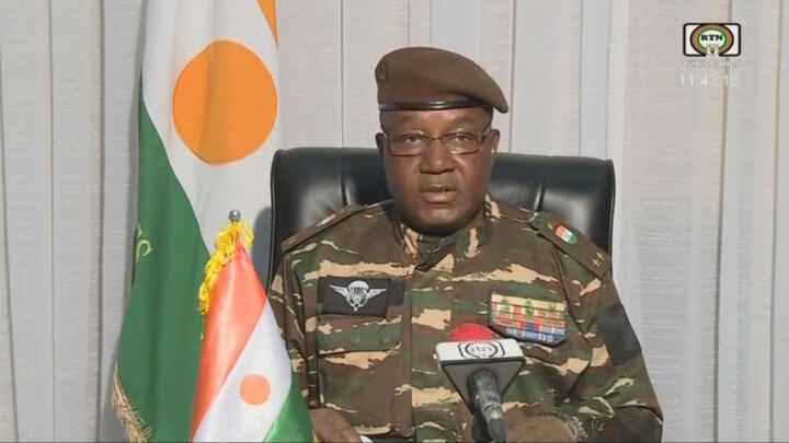 This video frame grab image obtained by AFP from ORTN - Télé Sahel on July 28, 2023 shows General Abdourahamane Tiani, Nigers new strongman, speaking on national television and reads a statement as "President of the National Council for the Safeguarding of the Fatherland", after the ouster of President-elect Mohamed Bazoum. 