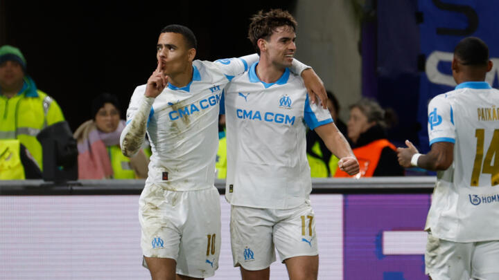 Marseille's Mason Greenwood, left, celebrates after scoring his sides third goal during the Champions League opening phase soccer match between Union SG and Marseilles in Brussels on December 9, 2025.