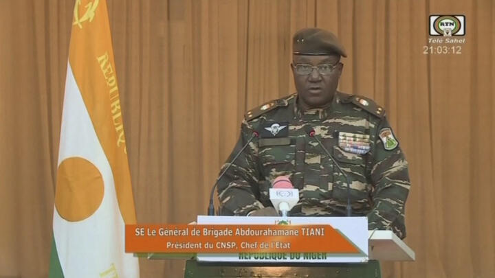 Niger's new military ruler General Abdourahamane Tiani reading a statement on national television on August 19, 2023.