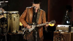 Singer and songwriter Neil Young performs at a concert in honour of fellow singer/songwriter Willie Nelson in Washington, DC on November 18, 2015.